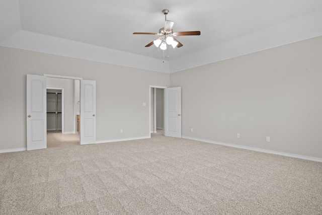 2217 Caroline Dr, Weatherford, TX 76087 - unfurnished bedroom with baseboards, light colored carpet, ceiling fan, and a spacious closet