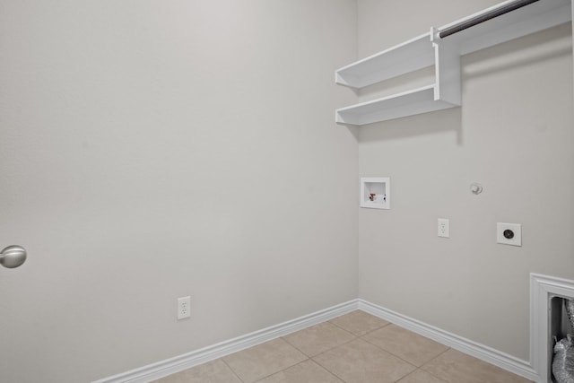 2217 Caroline Dr, Weatherford, TX 76087 - washroom featuring light tile patterned flooring, laundry area, hookup for a washing machine, electric dryer hookup, and baseboards