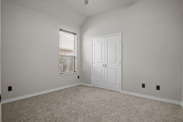 2217 Caroline Dr, Weatherford, TX 76087 - unfurnished bedroom featuring a closet, lofted ceiling, baseboards, light colored carpet, and a ceiling fan