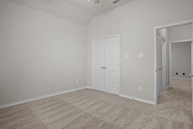2217 Caroline Dr, Weatherford, TX 76087 - unfurnished bedroom with baseboards, carpet, a closet, and lofted ceiling
