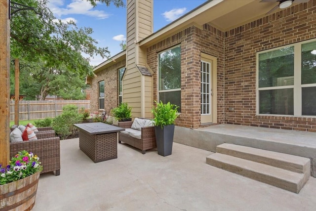 view of patio with fence and an outdoor hangout area