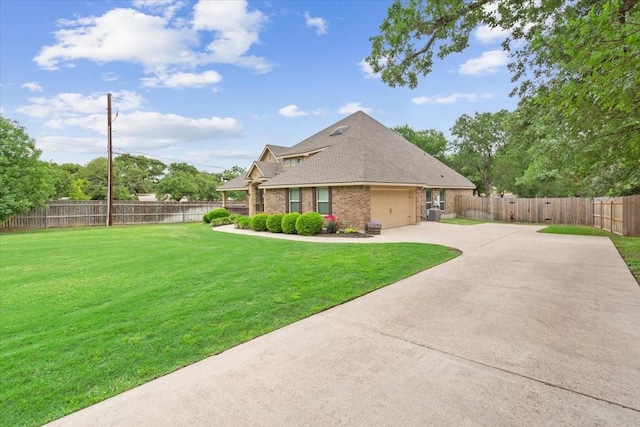view of home's exterior featuring fence, brick siding, a garage, a yard, and driveway