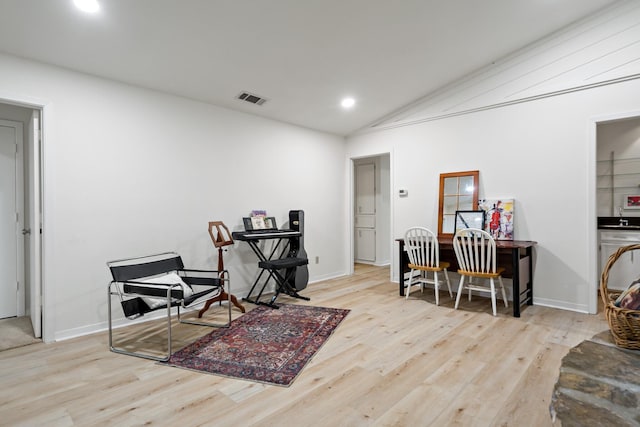 interior space featuring recessed lighting, visible vents, wood finished floors, and lofted ceiling