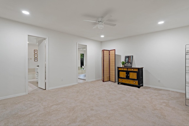 unfurnished bedroom featuring recessed lighting, carpet floors, and ensuite bath