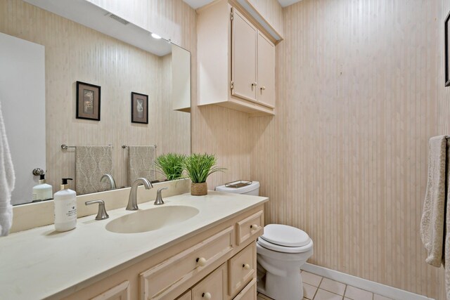 1308 Chesterton Dr, Richardson, TX 75080 - half bathroom with toilet, vanity, tile patterned floors, and wallpapered walls