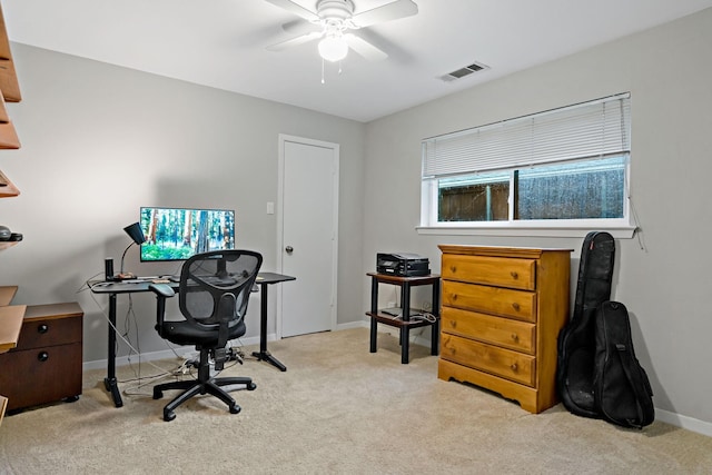 office area featuring carpet floors, baseboards, a ceiling fan, and visible vents