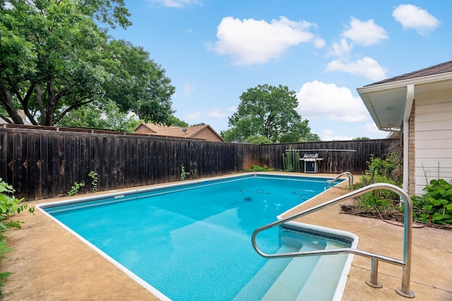 view of swimming pool with a patio, a fenced backyard, and a fenced in pool