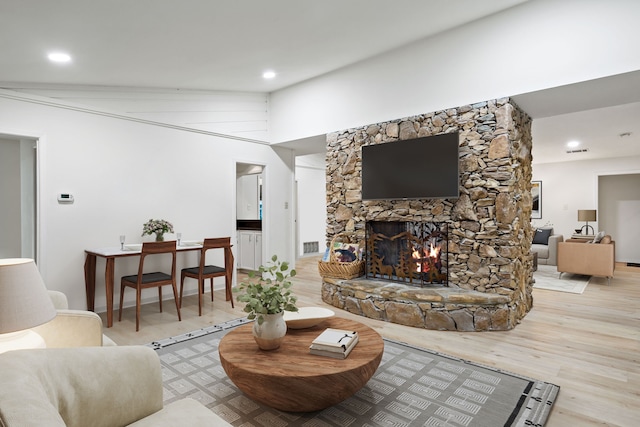 1308 Chesterton Dr, Richardson, TX 75080 - living area featuring wood finished floors, a stone fireplace, and recessed lighting