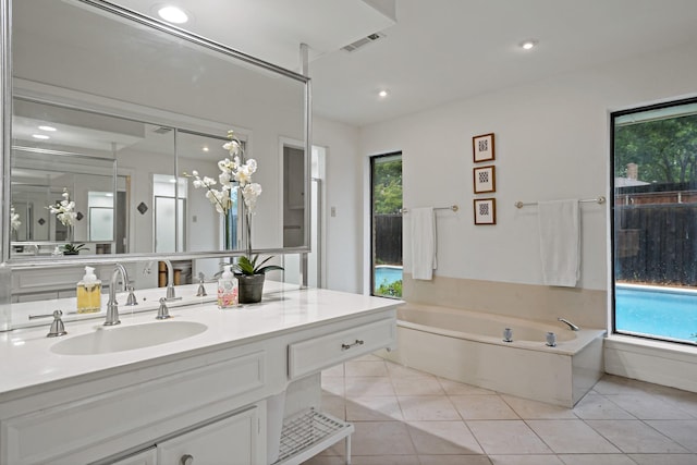 1308 Chesterton Dr, Richardson, TX 75080 - full bathroom featuring vanity, a bath, tile patterned flooring, and recessed lighting