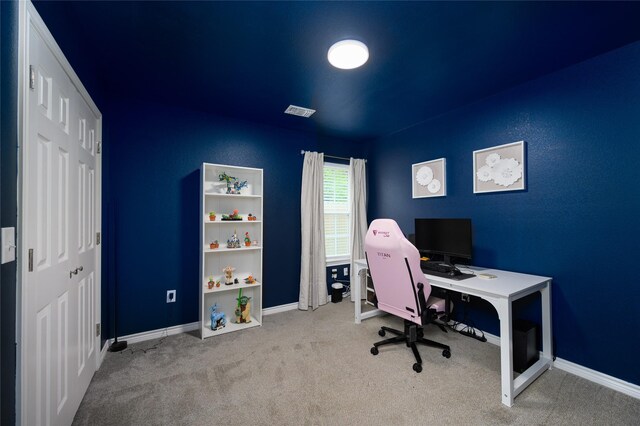 home office with carpet floors, baseboards, and visible vents