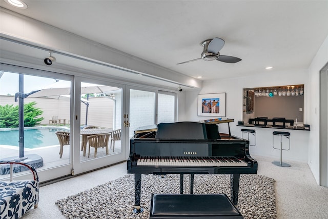 sitting room with recessed lighting, a ceiling fan, and speckled floor