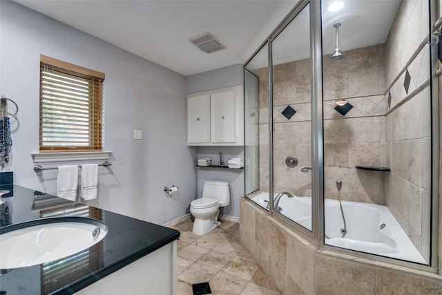 full bath featuring vanity, toilet, a combined bath / shower with rainfall shower, baseboards, and visible vents
