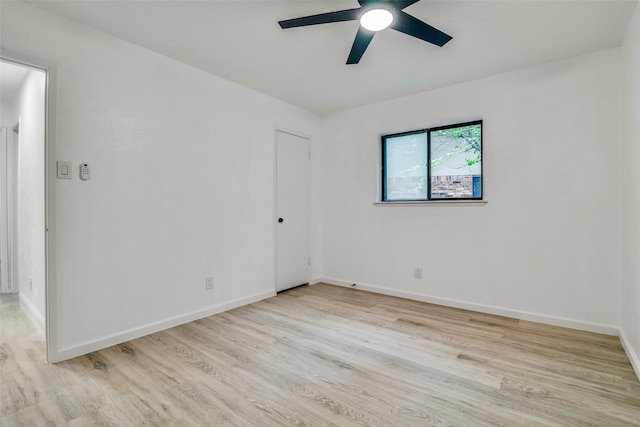 6401 Gate Ridge Cir, Garland, TX 75043 - unfurnished room with baseboards, ceiling fan, and wood finished floors