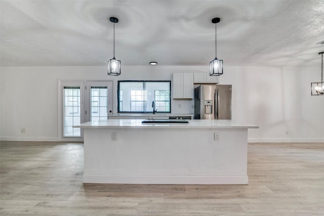 6401 Gate Ridge Cir, Garland, TX 75043 - kitchen featuring stainless steel fridge, light countertops, and light wood-style flooring