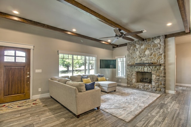 living room with beam ceiling, ceiling fan, wood finished floors, baseboards, and recessed lighting