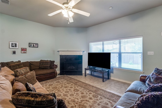 9204 Lockhart Dr, Arlington, TX 76002 - living room with tile patterned flooring, ceiling fan, a fireplace, and baseboards