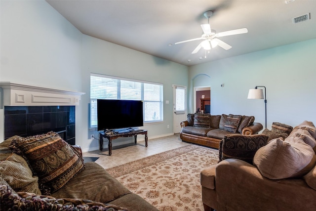 9204 Lockhart Dr, Arlington, TX 76002 - living area with light tile patterned floors, ceiling fan, and baseboards