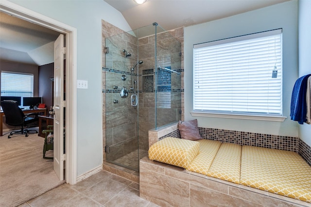 9204 Lockhart Dr, Arlington, TX 76002 - full bathroom featuring a stall shower, lofted ceiling, tile patterned floors, and baseboards
