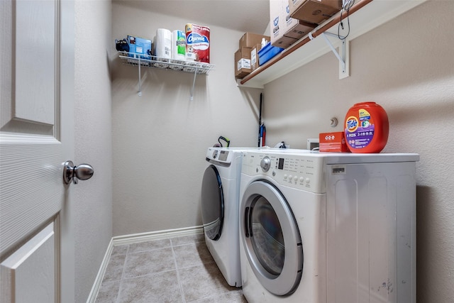9204 Lockhart Dr, Arlington, TX 76002 - washroom with independent washer and dryer, baseboards, and light tile patterned floors