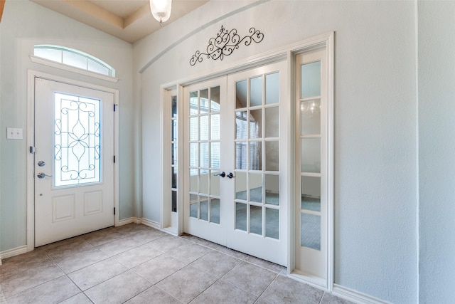 9204 Lockhart Dr, Arlington, TX 76002 - entryway featuring french doors, light tile patterned flooring, and baseboards