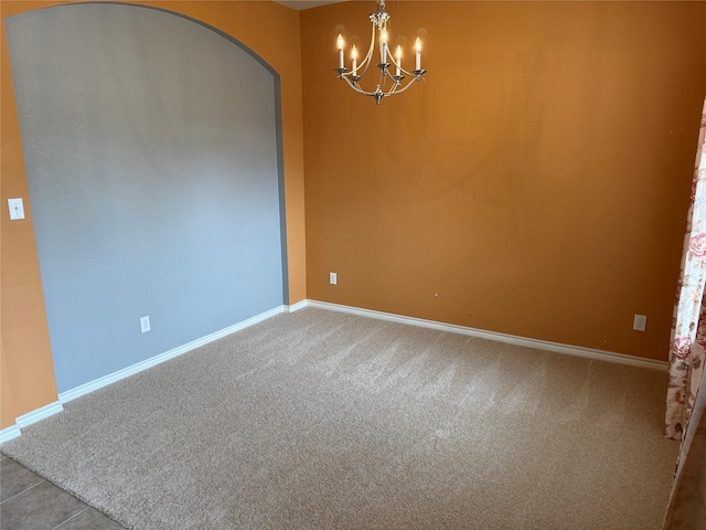 9204 Lockhart Dr, Arlington, TX 76002 - carpeted spare room with a chandelier, baseboards, and arched walkways