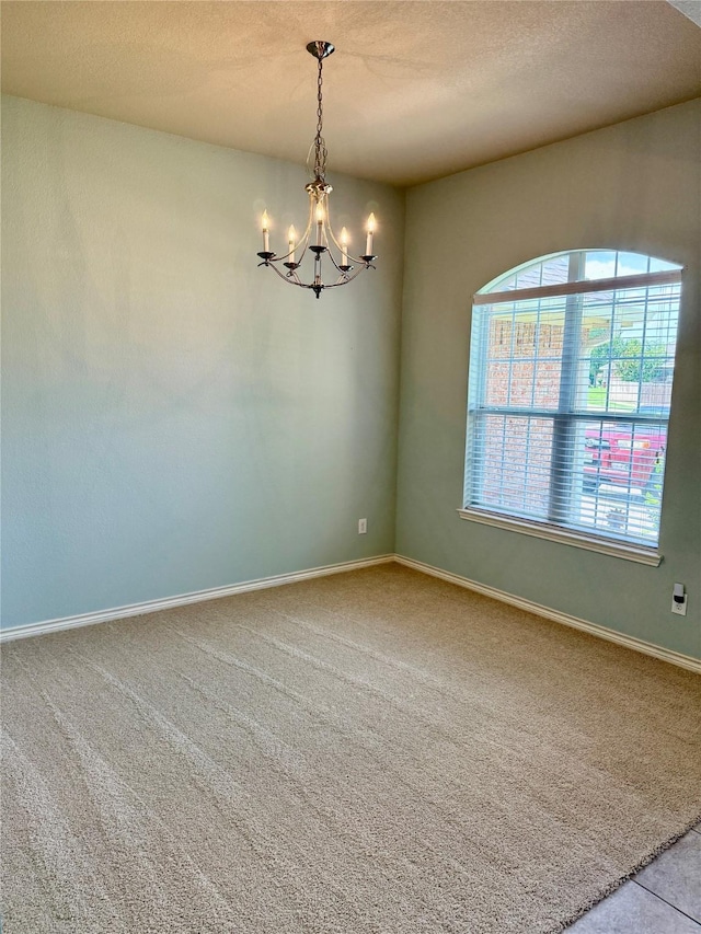 9204 Lockhart Dr, Arlington, TX 76002 - unfurnished room featuring a chandelier, carpet, a textured ceiling, and baseboards