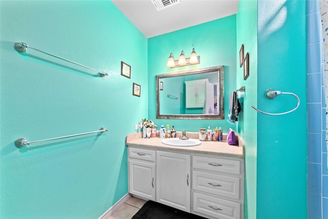 bathroom with tile patterned floors, vanity, and visible vents