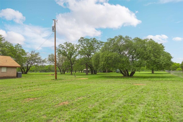 view of yard with central AC unit