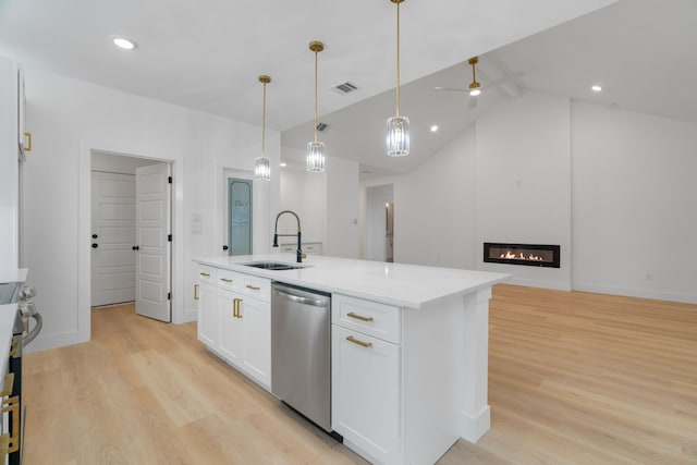 kitchen featuring white cabinets, light wood-type flooring, a sink, and dishwasher