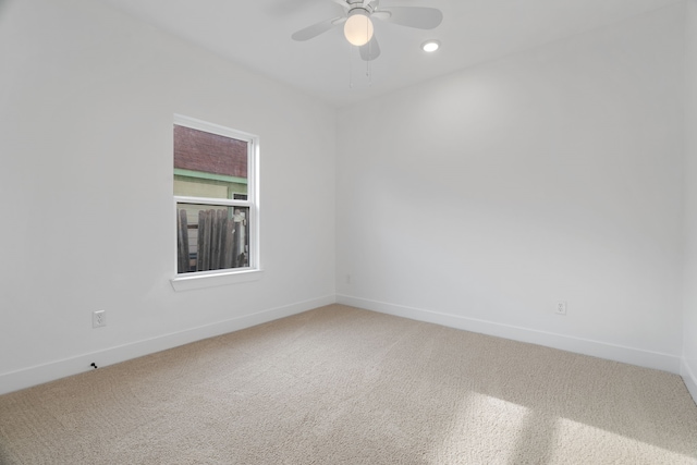 spare room featuring baseboards, carpet, a ceiling fan, and recessed lighting