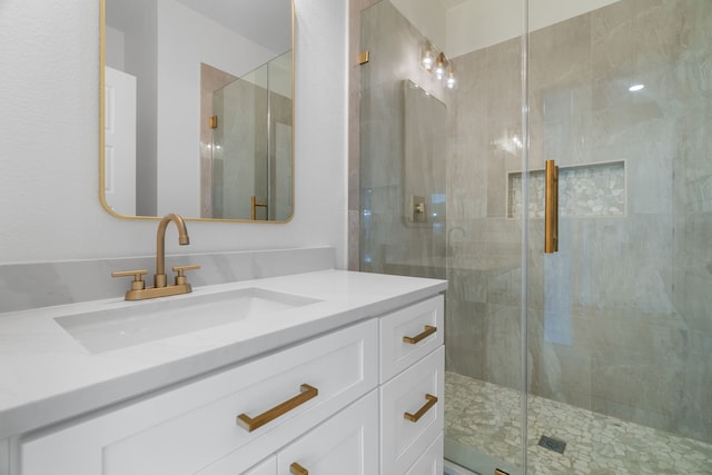 full bathroom featuring vanity and a stall shower