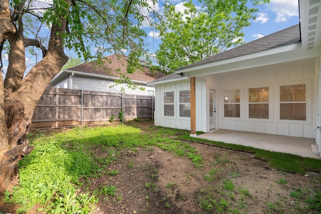 view of yard with fence and a patio area