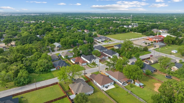 birds eye view of property with a forest view and a residential view