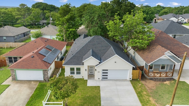 birds eye view of property with a residential view
