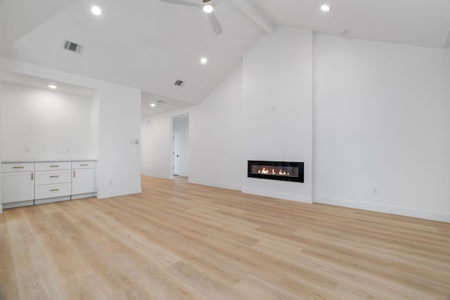 unfurnished living room featuring visible vents, light wood-style floors, ceiling fan, and beam ceiling