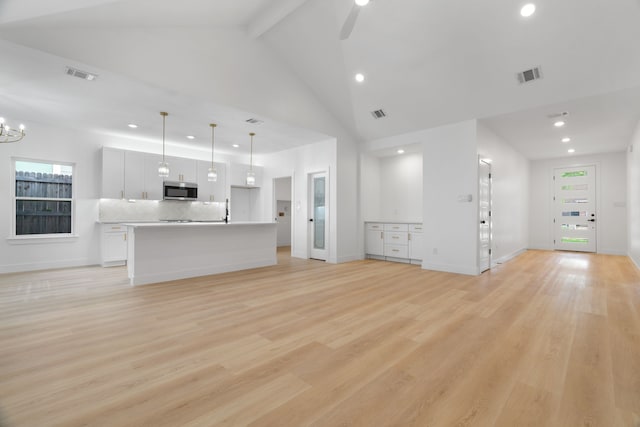 unfurnished living room with recessed lighting, visible vents, and a wealth of natural light