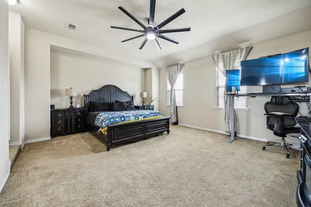 carpeted bedroom with baseboards, visible vents, and ceiling fan