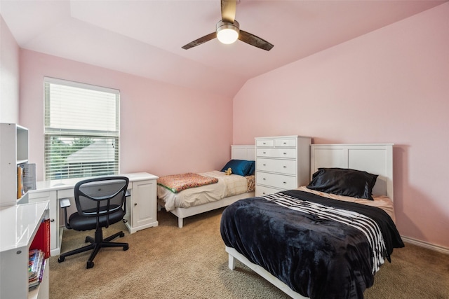 bedroom featuring a ceiling fan, lofted ceiling, and light colored carpet