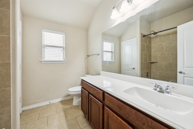 full bath with walk in shower, vanity, baseboards, toilet, and lofted ceiling