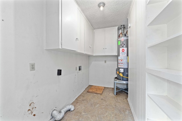 laundry room with baseboards, a textured ceiling, gas water heater, cabinet space, and washer hookup