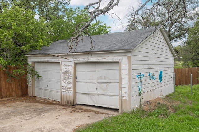 detached garage with fence