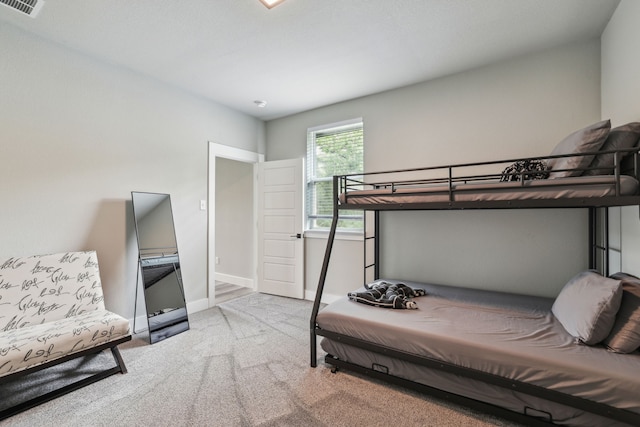 811 County Road 3451, Paradise, TX 76073 - bedroom featuring carpet floors, baseboards, and visible vents