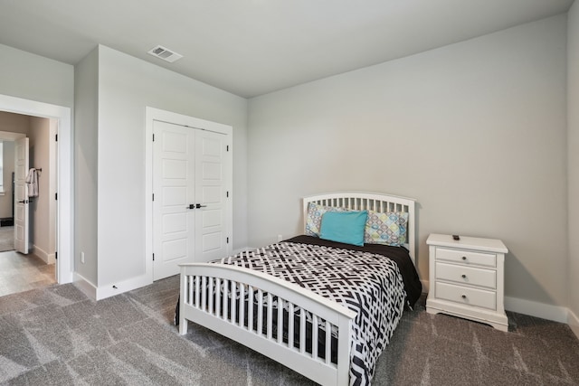811 County Road 3451, Paradise, TX 76073 - carpeted bedroom with baseboards, a closet, and visible vents
