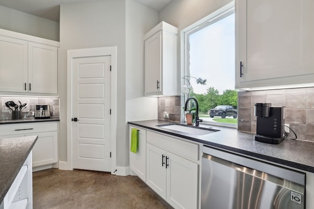 811 County Road 3451, Paradise, TX 76073 - kitchen with a sink, backsplash, dishwasher, and dark countertops