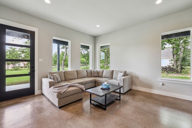 811 County Road 3451, Paradise, TX 76073 - living room featuring recessed lighting, baseboards, concrete floors, and a wealth of natural light