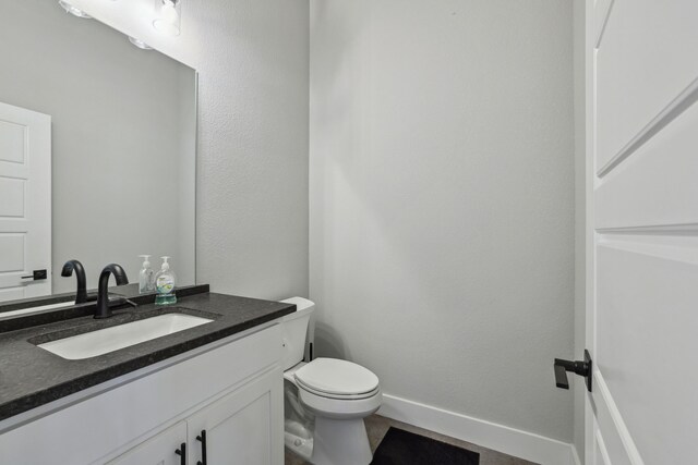 811 County Road 3451, Paradise, TX 76073 - bathroom featuring vanity and toilet
