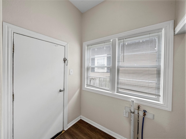 1227 W Walker St, Denison, TX 75020 - entryway with baseboards and dark wood-style flooring