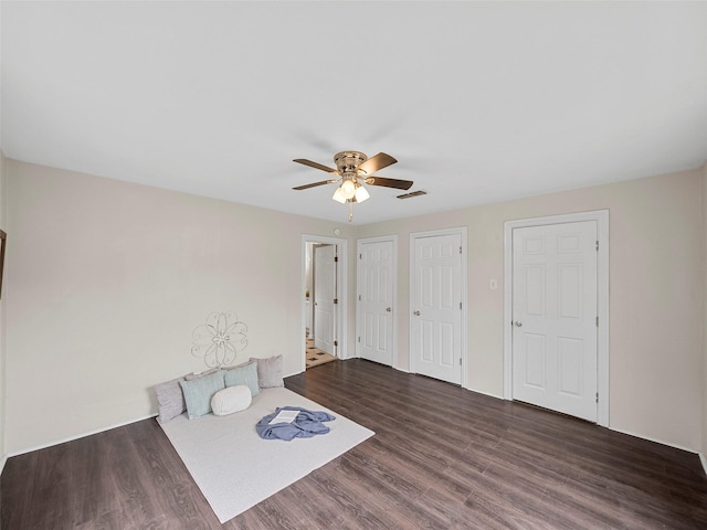 1227 W Walker St, Denison, TX 75020 - interior space featuring visible vents, a ceiling fan, multiple closets, and wood finished floors