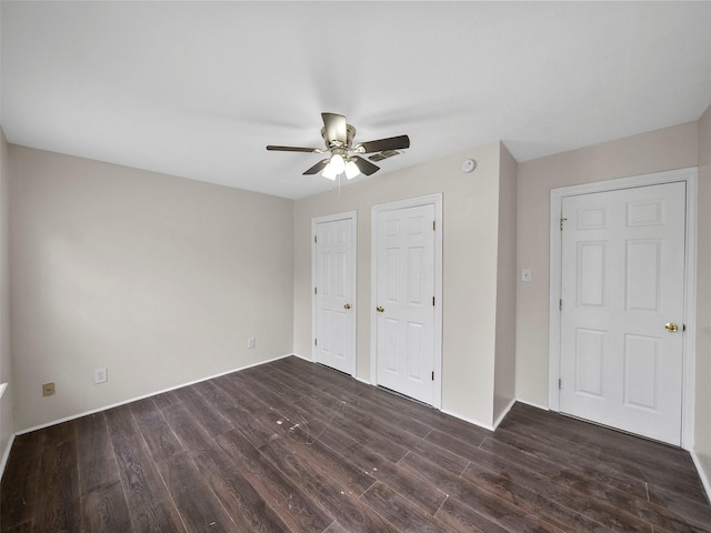 1227 W Walker St, Denison, TX 75020 - unfurnished bedroom featuring ceiling fan and dark wood-style flooring