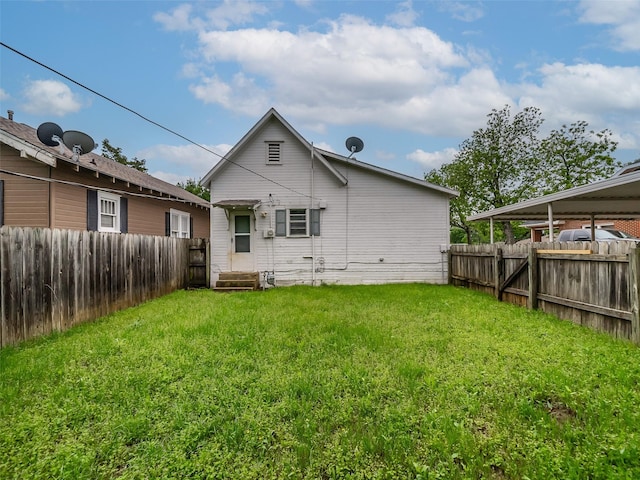 1227 W Walker St, Denison, TX 75020 - back of property with a fenced backyard and a yard